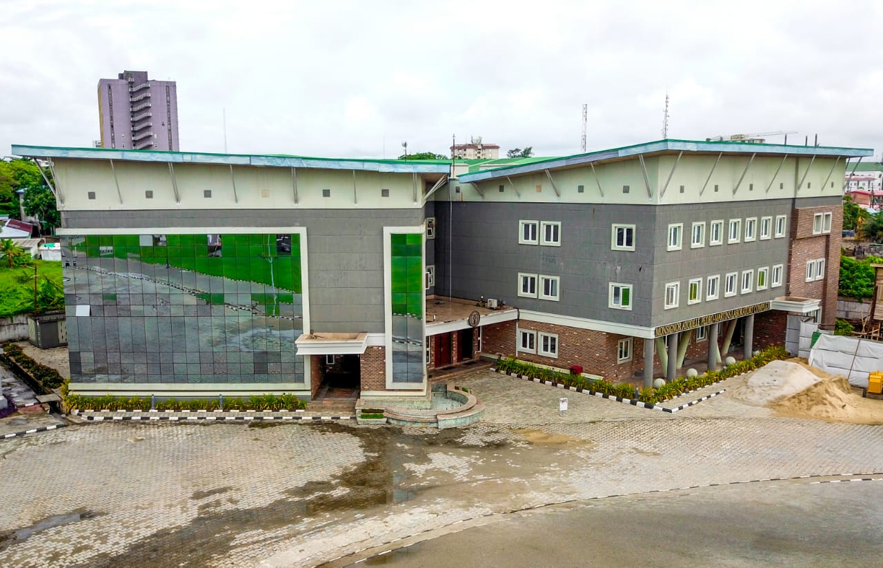 The Monsignor building — a modern glass and stone academic block