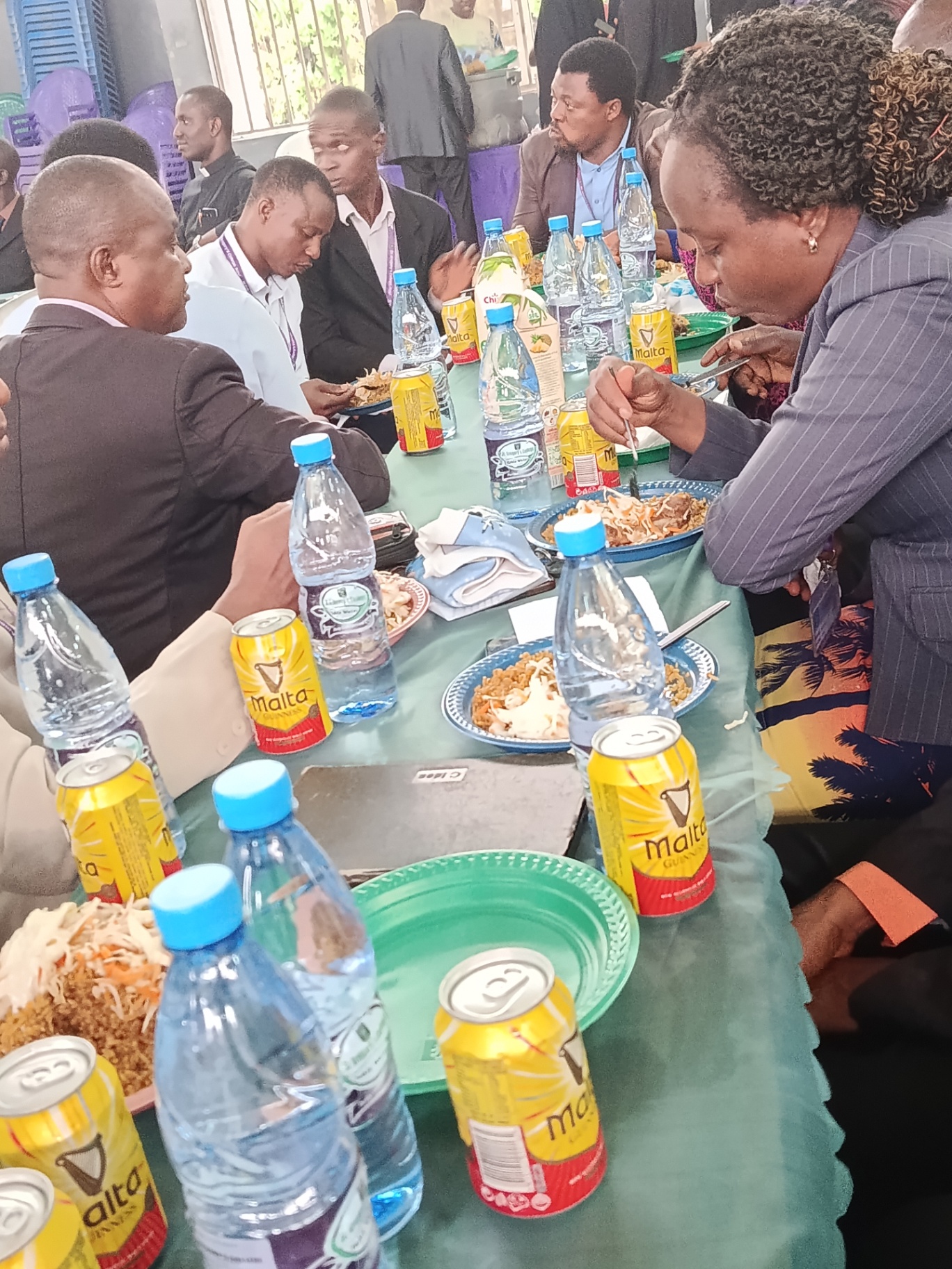 Staff sharing a meal at a long table