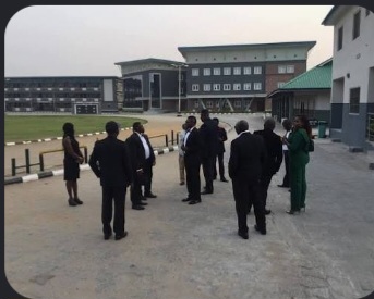 Members of the College community outside a campus building