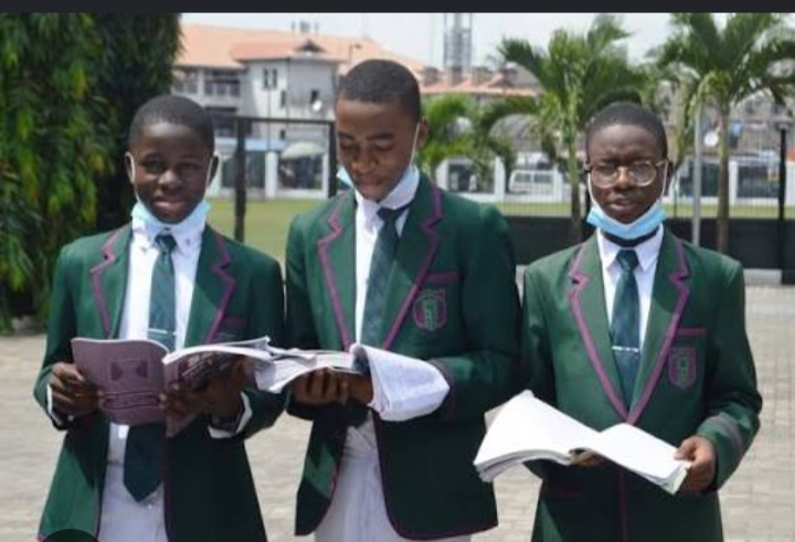 St. Gregory's College students in uniform reading and studying