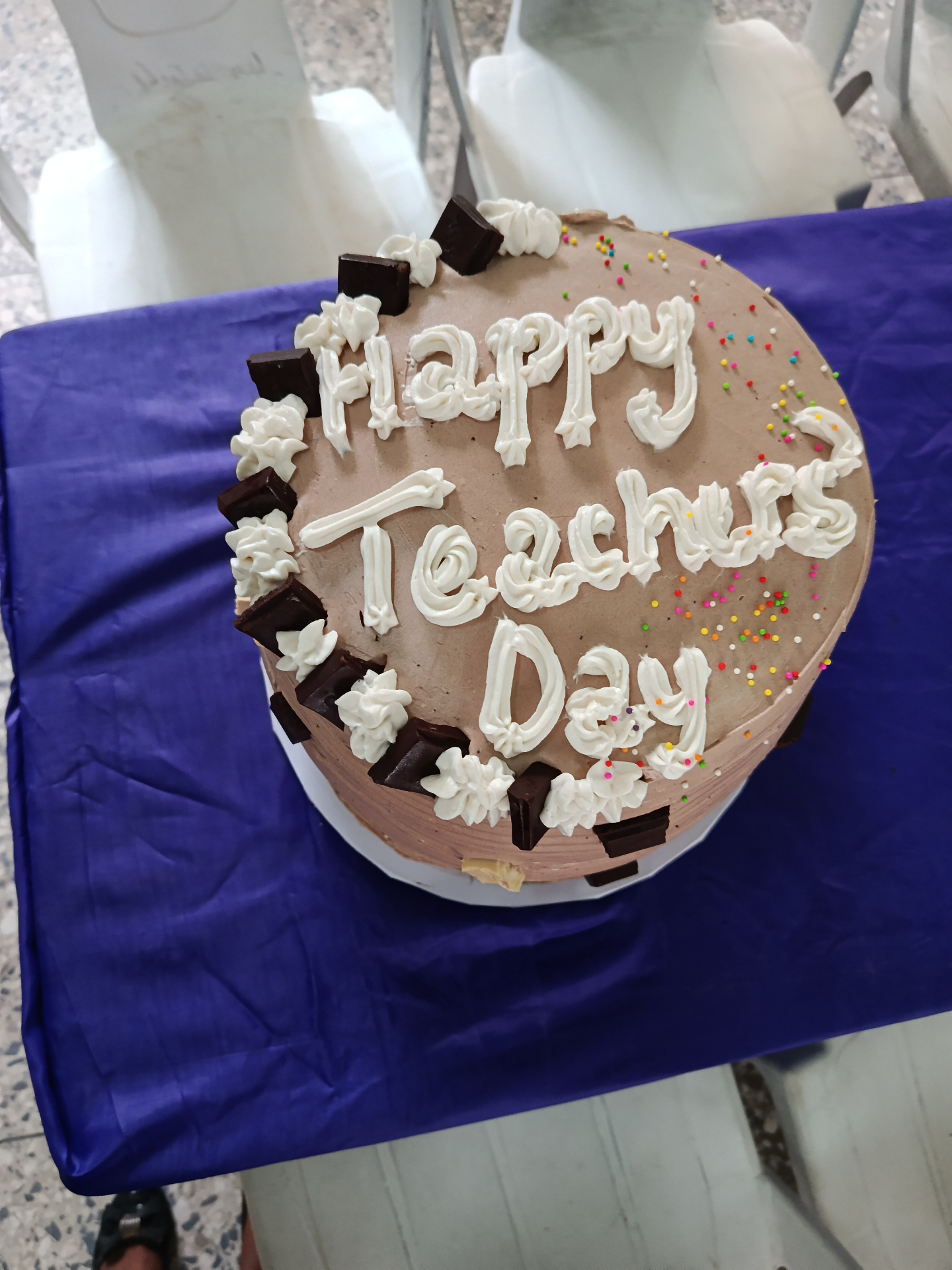 A cake decorated with the words Happy Teachers Day