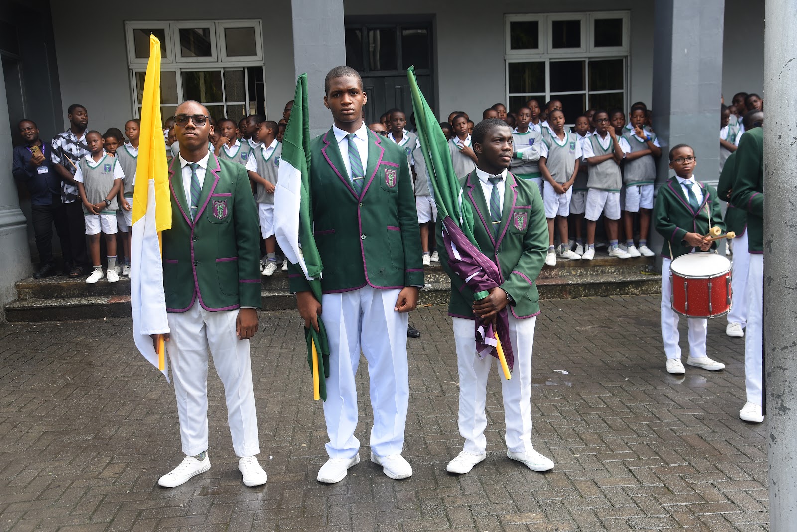 Students in ceremonial dress standing in the College courtyard