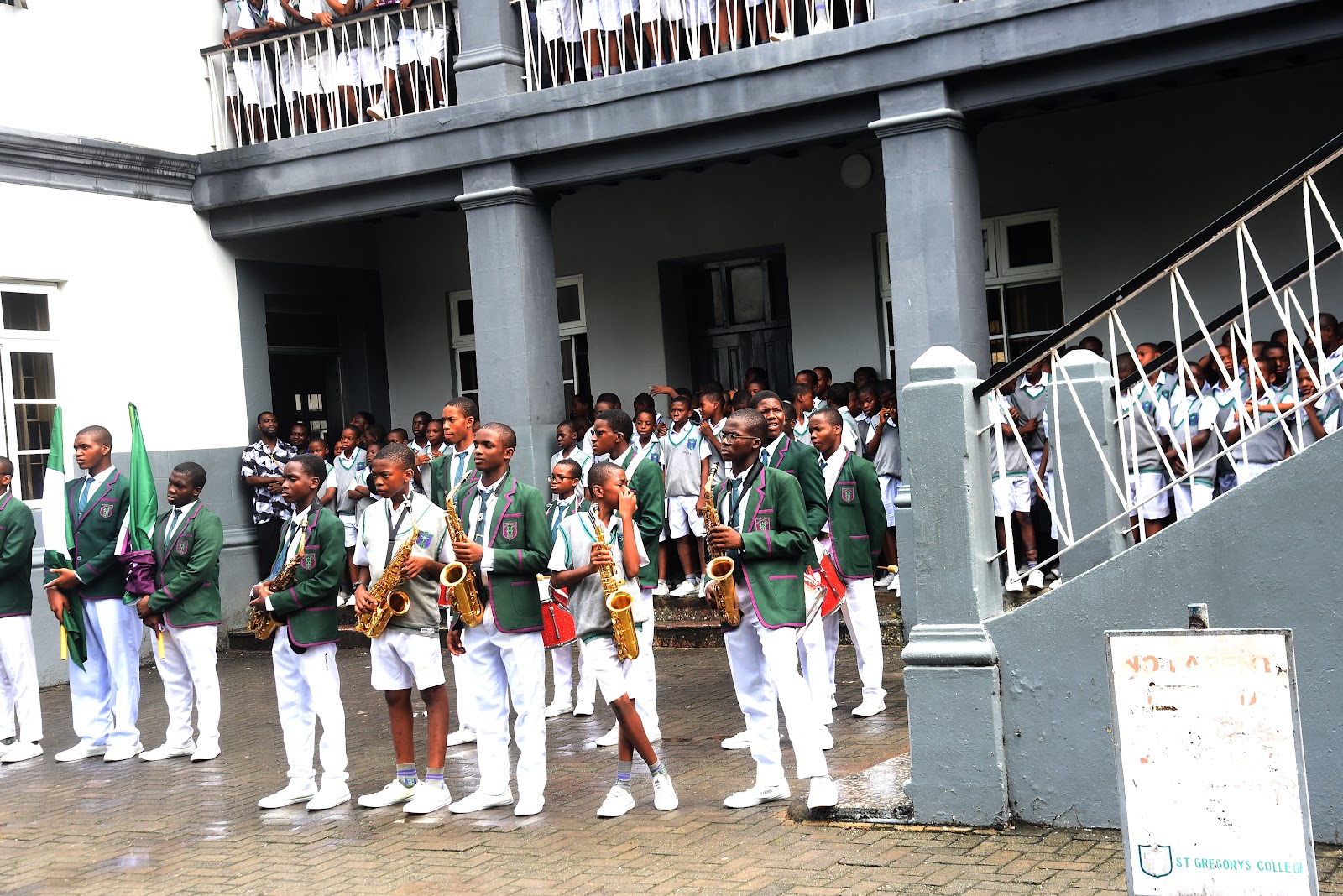 Students gathered on the steps of a College building during an official visit
