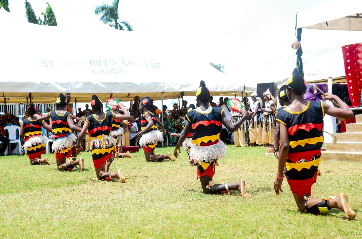 Students performing a traditional dance at a College event